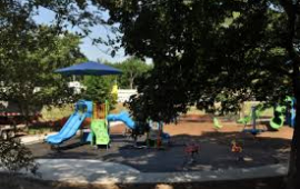 Stubby park playground and paved sidewalk in 2020