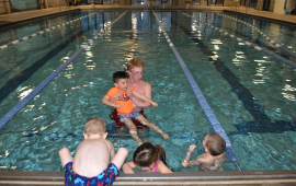 Swim Lesson with four children and instructor at Riverfront Community Center Pool