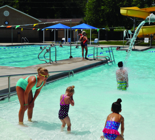 Mom with two daughters at Wollman Aquatic Center's walk in pool entry