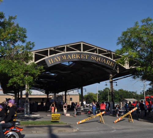 People gathered at Haymarket Square for an event. To reserve it, please call City Clerk's Office