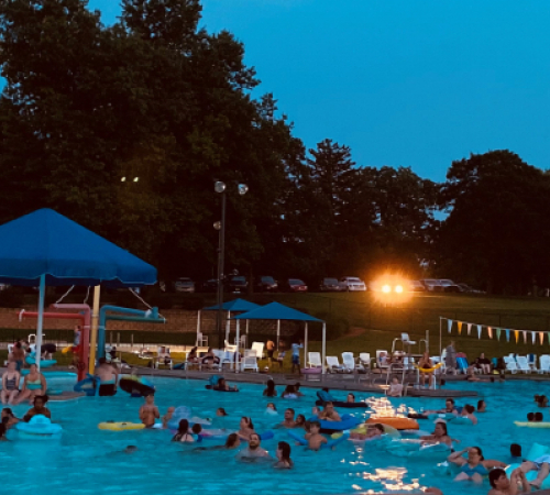 2021 Family night at the Wollman Aquatic Center Families enjoying a movie in the pool at the Wollman Aquatic Center