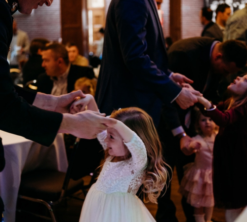 Fathers dancing with their daughters at the Daddy and Me Sweetheart Tea