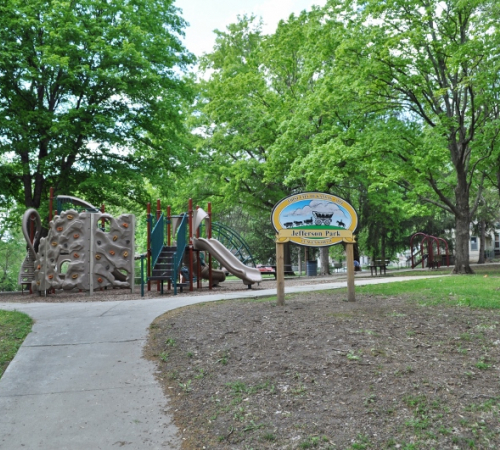 Jefferson Park Playground equipment with the sign