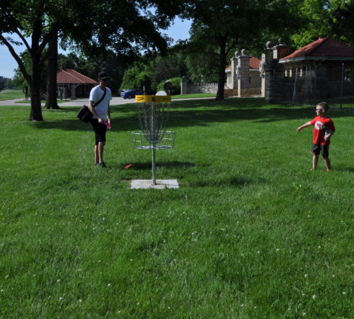 A family enjoying a game of disc golf at Ray Miller Park