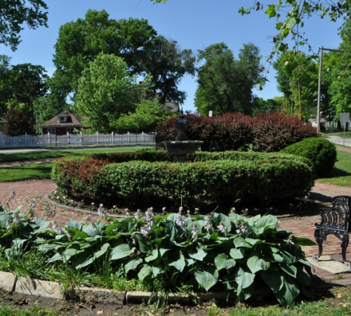 Fountain, benches, and hostas at Union Park