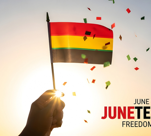 Juneteenth hand reaches for small flag with bands of red, yellow and green surrounded by confetti with text June 19 Juneteenth Freedom day