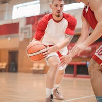 Men playing basketball