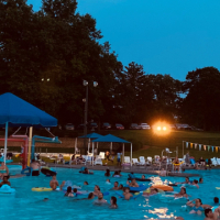 2021 Family night at the Wollman Aquatic Center Families enjoying a movie in the pool at the Wollman Aquatic Center