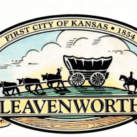 Logo of City with works Leavenworth, First City of Kansas 1854 and an ox-drawn covered wagon followed by a horse