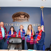 Fifa scarves Five elected city commissioners pose with FIFA scarves in front of City logo