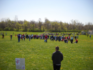 Photo of adults helping kids find Easter eggs in 2011