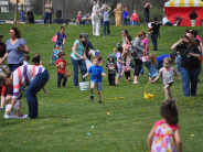 Young children running for eggs 