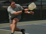 A guy playing pickleball 