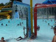 Wollman Aquatic Center with water spouts and swimmers having fun