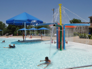 Wollman Aquatic Center with water spouts and swimmers having fun