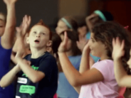 Kids performing on stage for theater camp - advertising free photo