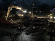 night time image of construction equipment working at a site