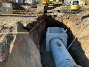 Image of culvert tube and box in the ground at construction site