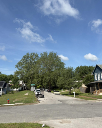 photo shows street with a partial sidewalk ending in grass at second and pottawatomie street