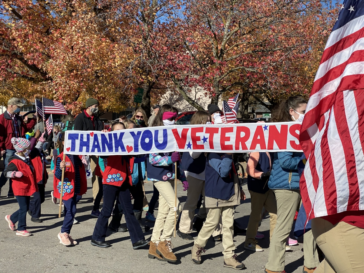 Children carry banner in Veterans Day parade that reads, "Thank You Veterans" Children carry banner in Veterans Day parade that reads, "Thank You Veterans"