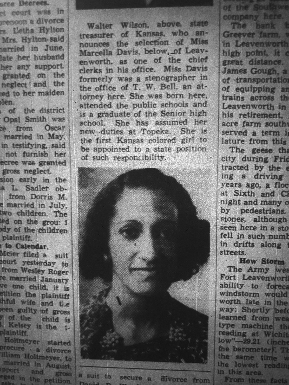 Marcella Davis Newspaper clipping with picture of a young woman with curly hair and dark skin wearing earrings and flowered print dress