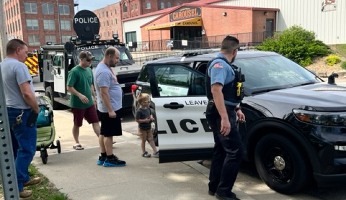 Kids touching the Leavenworth Police Department SUV and SWAT Vehicle in 2024