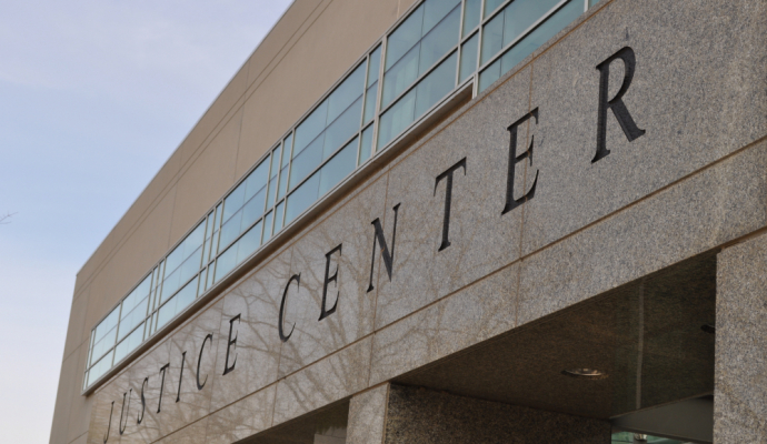 Photo of building with sign that reads Justice Center