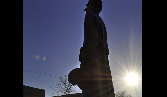 Photo of Abraham Lincoln statue holding top hat with Text Presidents Day Monday, Feb. 16